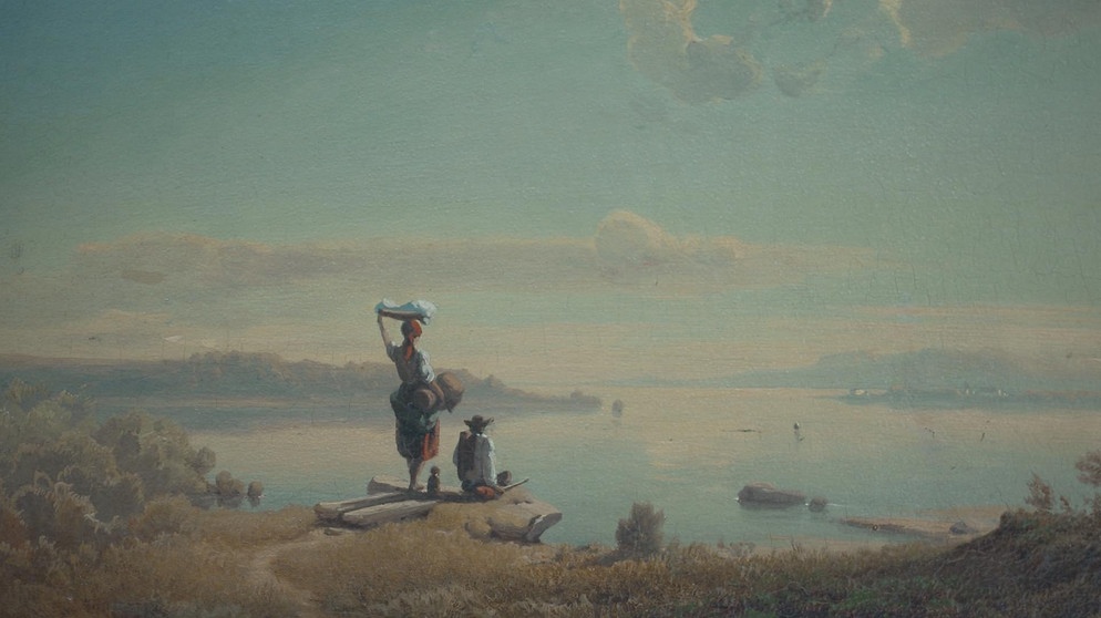 Ein Gemälde von August Seidel. Portraitiert wird eine idyllische Landschaft am Wasser, an der Küste geniessen Zwei Personen die Aussicht | Bild: BR