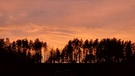 Sonnenuntergang mit Abendröte am 3. Advent in Stockheim. | Bild: Wolfgang Hopf, Stockheim, 18.12.2023