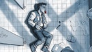 Cover der Graphic Novel "Drei Steine" - ein Junge liegt zusammengeschlagen auf dem Boden einer Schultoilette | Bild: Panini