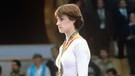 Olympische Spiele in Moskau 1980, Siegerehrung Schwebebalken: (l-r) Natalia Schaposchnikowa (UdSSR, Bronze), Nadia Comaneci (Rumänien, Gold) und Jelena Dawydowa (UdSSR, Silber). | Bild: picture-alliance/dpa