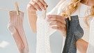 Einzelne Socken werden an einer Wäscheleine aufgehängt. | Bild: colourbox.com