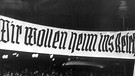 Deutsche Faschisten demonstrieren 1938 in der tschechischen Grenzregion unter dem Motto Wir wollen heim ins Reich. Kurze Zeit später wurden Tschechen aus der Grenzregion vertrieben | Bild: picture-alliance/dpa