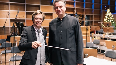 Checker Tobi zusammen mit Frank Beermann beim Münchner Rundfunkorchester. | Bild: BR/megaherz gmbh/Hans-Florian Hopfner