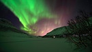 Polarlichter, aufgenommen in der Nähe von Tromsö, Norwegen. Polarlichter sind Gradmesser für das Weltraumwetter. | Bild: picture-alliance/dpa/Bildagentur-online/Gernhoefer-Mc