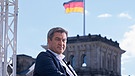 CSU-Vorsitzender Markus Söder in Berlin, im Hintergrund die Deutschlandflagge | Bild: picture-alliance/dpa | Flashpick / Jens Krick