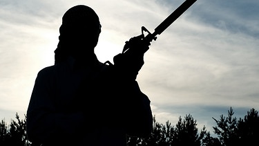 Symbolbild: Islamistischer Kämpfer mit Maschinengewehr | Bild: colourbox.com