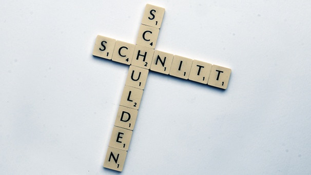 Scrabblewürfel die das Wort "Schuldenschnitt" bilden | Bild: picture-alliance/dpa