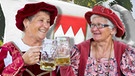 Zwei Frauen stoßen an beim Tag der Franken in Schwabach | Bild: picture-alliance/dpa; Montage: BR