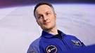 ESA-Astronaut Matthias Maurer nach seiner Rückkehr von der Weltraummission Cosmic Kiss auf der Internationalen Raumstation ISS.  | Bild: picture alliance / Panama Pictures | Christoph Hardt