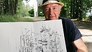 Der Filmautor Jürgen Neumann ist mit Bleistift und Skizzenblock in Hirschau unterwegs. Er zeichnet Gebäude des Ortes und trifft dabei einheimische Menschen. | Bild: BR