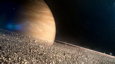 Die Saturn-Ringe bestehen aus unzähligen Materiepartikeln, manche mikroskopisch klein, andere so groß wie Wolkenkratzer (Computergenerierte Darstellung). | Bild: BBC / Brian Cox / Created by Lola Post Production