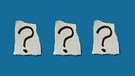 Fragezeichen auf karierten Papierschnipseln, für "Do Re Mikro - Das Geheimnis" | Bild: colourbox.com