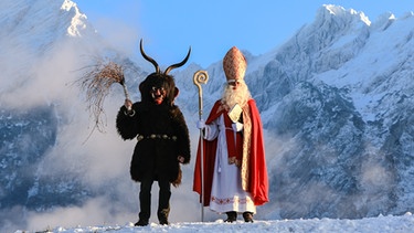 Nikolaus und Krampus beim Nicolospiel in Krungl (Österreich) | Bild: picture-alliance/dpa