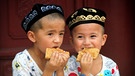 Muslimische Kinder in China feiern das Ende des Ramadans | Bild: picture-alliance/dpa