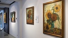 Eine Fälschung des Bildes "Sieben Sonnenblumen" des Malers Vincent Van Gogh hängt in der Ausstellung "Echt falsch - Das Phänomen der Kunstfälschung" in der Fabrik der Künste in Hamburg.  | Bild: picture-alliance/dpa