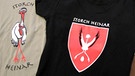 Kleidung mit der Aufschrift "Storch Heinar" | Bild: picture-alliance/dpa