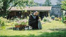 Schwester Barbara (Corinna Harfouch) im Klostergarten. | Bild: BR/Roxy Film GmbH/Hendrik Heiden