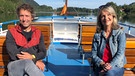 Peter Schlickenrieder und Marianne Kreuzer am Deck eines Bootes auf dem Schliersee. | Bild: BR/Beate Merz