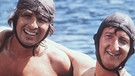 Thomas Gottschalk und Mike Krüger in einer Filmszene aus dem 80er-Jahre Klassiker "Zwei Nasen tanken Super". | Bild: picture-alliance/dpa