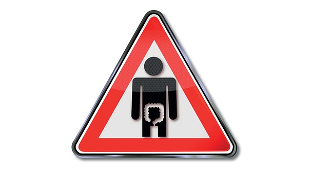 Straßenschild "Achtung" mit stilisiertem Darm im Bauchraum eines Menschen | Bild: colourbox.com