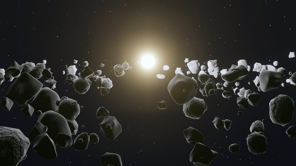 Ein Asteroidenfeld mit der Sonne im Hintergrund | Bild: picture-alliance/dpa