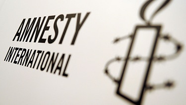 Logo der Organisation Amnesty International | Bild: picture alliance / ZB | Britta Pedersen