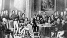 Zeitgenössische Darstellung vom Wiener Kongress, stehend im Vordergrund links: Klemens Wenzel Fürst von Metternich | Bild: picture-alliance/dpa
