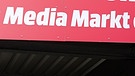 Werbeschild Media Markt München mit der Aufschrift: "Herzlich willkommen zum ersten Media Markt der Welt." | Bild: BR/Miriam Garufo