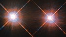 Diese Bild wurde mit dem Hubble-Weltraumteleskop aufgenommen und zeigt das Doppelsternsystem Alpha Centauri A und B. Nicht im Bild: Der Stern Proxima Centauri, der das Doppelsternsystem umrundet.  | Bild: ESA/Hubble & NASA
