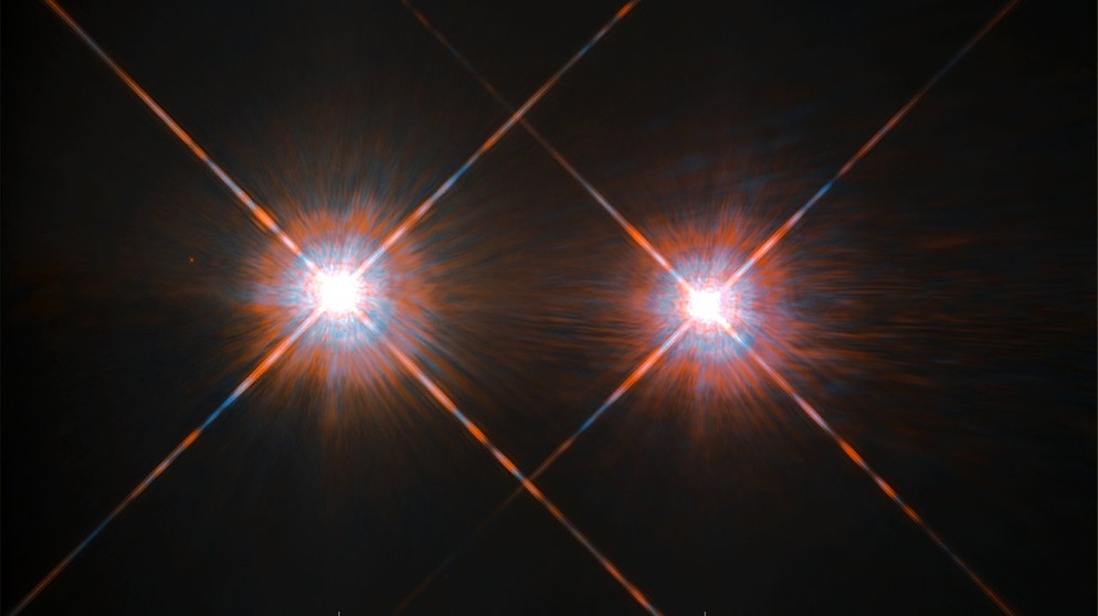 Diese Bild wurde mit dem Hubble-Weltraumteleskop aufgenommen und zeigt das Doppelsternsystem Alpha Centauri A und B. Nicht im Bild: Der Stern Proxima Centauri, der das Doppelsternsystem umrundet.  | Bild: ESA/Hubble & NASA